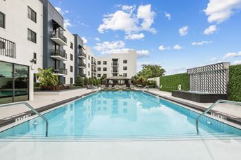 Tropical pool deck with waterfall feature